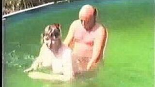 Older amateur couple in pool - porn video